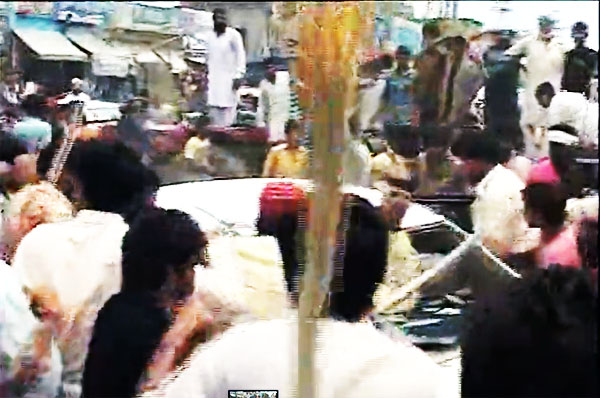 Electricity Load Shedding Protesters Breaking a Private Car