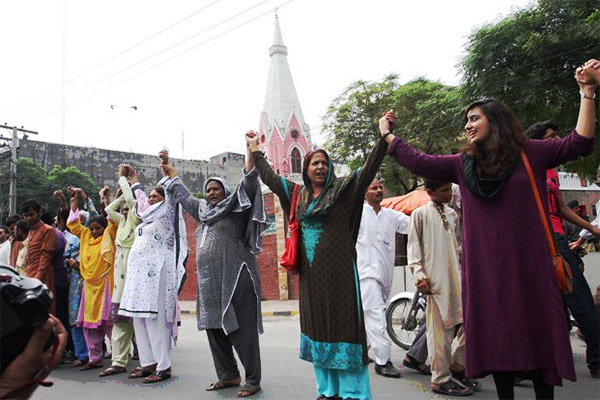 Pakistani Muslims and Christians Holding Hands together in Solidarity