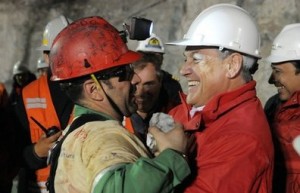 Chile president hugging a rescued miner